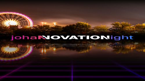 Riesenrad am Rheinufer bei Nacht mit „johanNOVATIONight“ Text