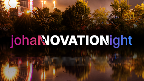 Riesenrad am Rheinufer bei Nacht mit „johanNOVATIONight“ Text